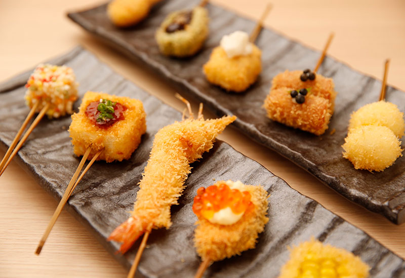 Ginan Shinsaibashi specializing in kushikatsu and kamameshi served in soup stock